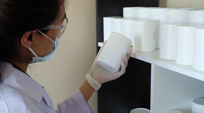 Technician preparing artwork in a cleanroom